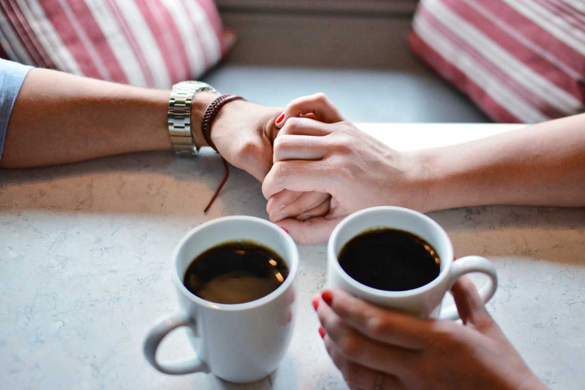 Two people holding hands